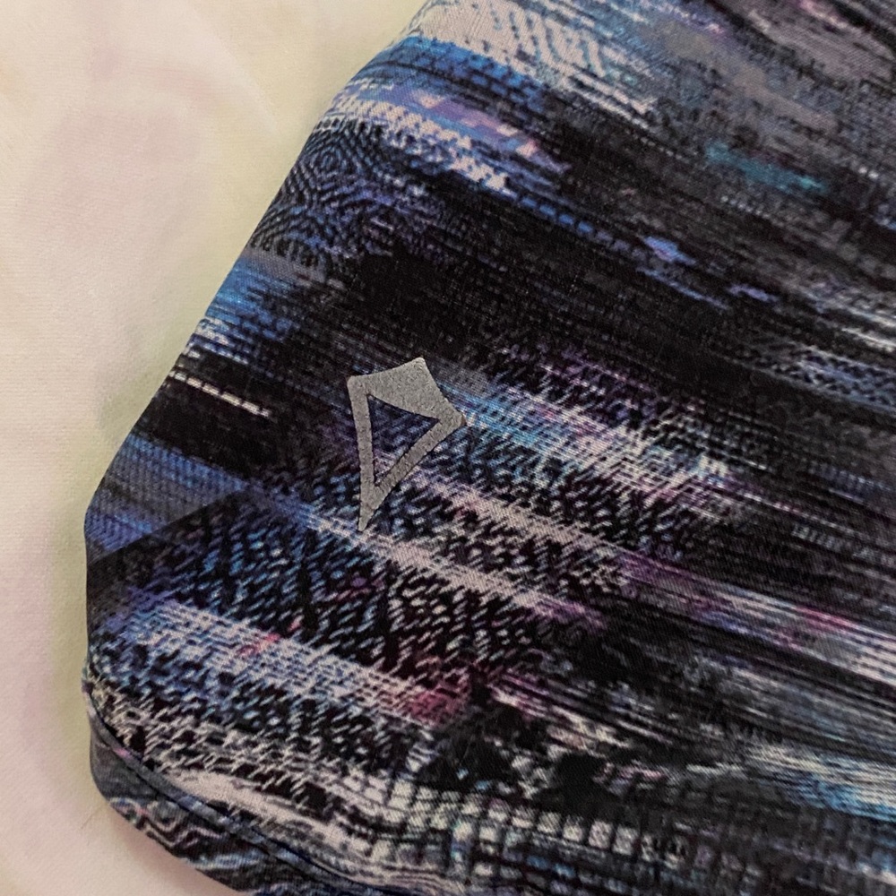 Ivivva Lululemon size 8-10 and have black, white, purple and blue coloring.